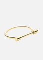 24K gold amika logo bracelet side | amika
